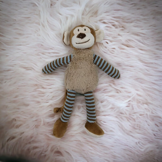 Soft plush monkey toy with striped arms and legs, perfect for nursery decor or baby gifts
