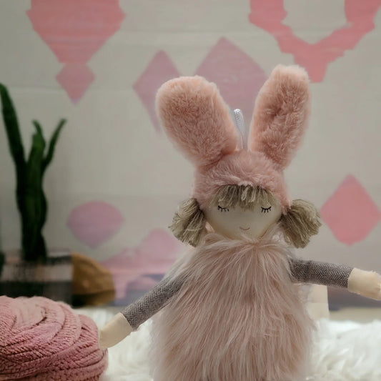 Pink plush bunny doll with fluffy ears and soft fur, perfect for nursery dΓ©cor or child's room
