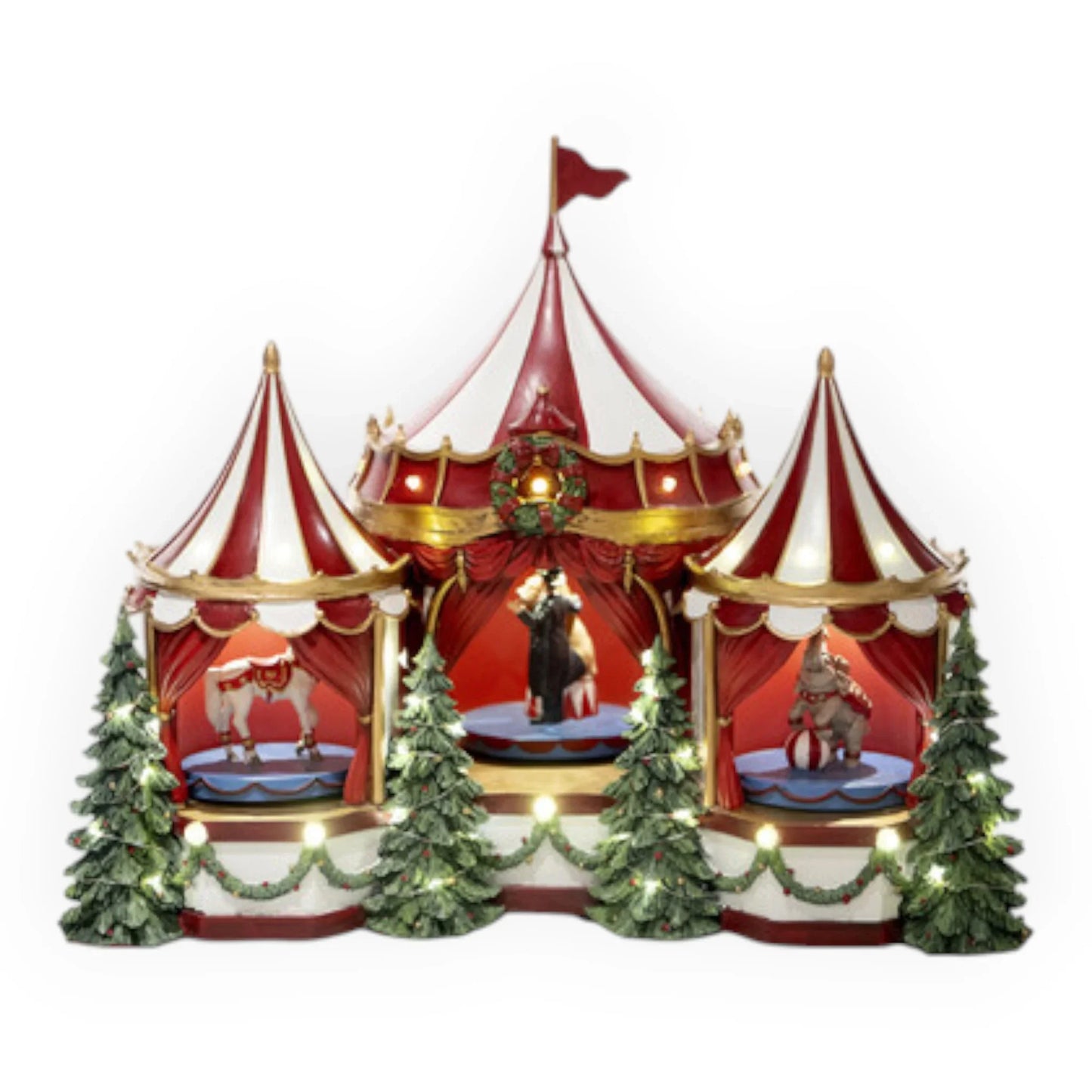 Red and white striped circus tent with carousel horses, elephant, and Christmas trees, illuminated for holiday décor