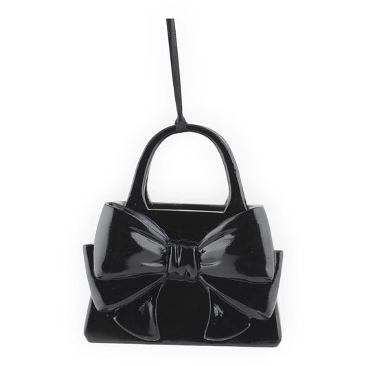 Glossy black handbag ornament with large bow, perfect for home décor or festive hanging display.