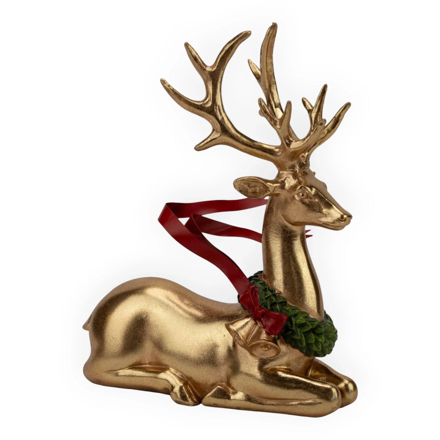 Golden lying reindeer figurine with red ribbon and green wreath, festive holiday home décor