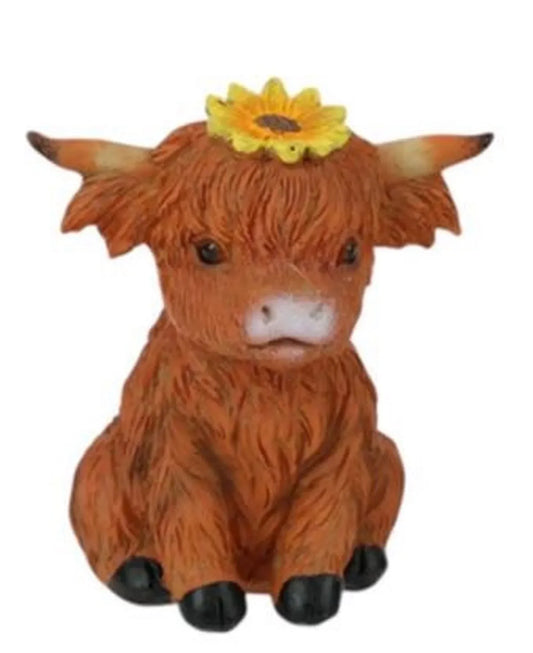 Cute Highland cow figurine with sunflower, rustic home décor accent piece