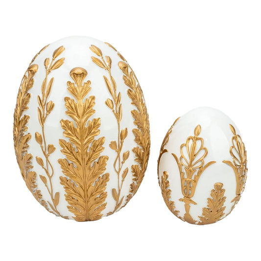 White decorative eggs with gold leaf and floral designs, elegant home décor accents