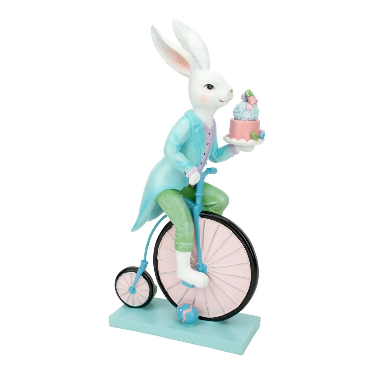 Charming Easter bunny figurine on vintage tricycle holding a pastel cake, perfect home décor accent.