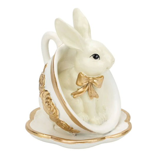 White bunny figurine in gold-accented teacup with bow, elegant home décor accent piece