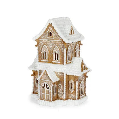 Gingerbread house decoration with snow-dusted roof and ornate icing details, perfect for holiday home dΓ©cor