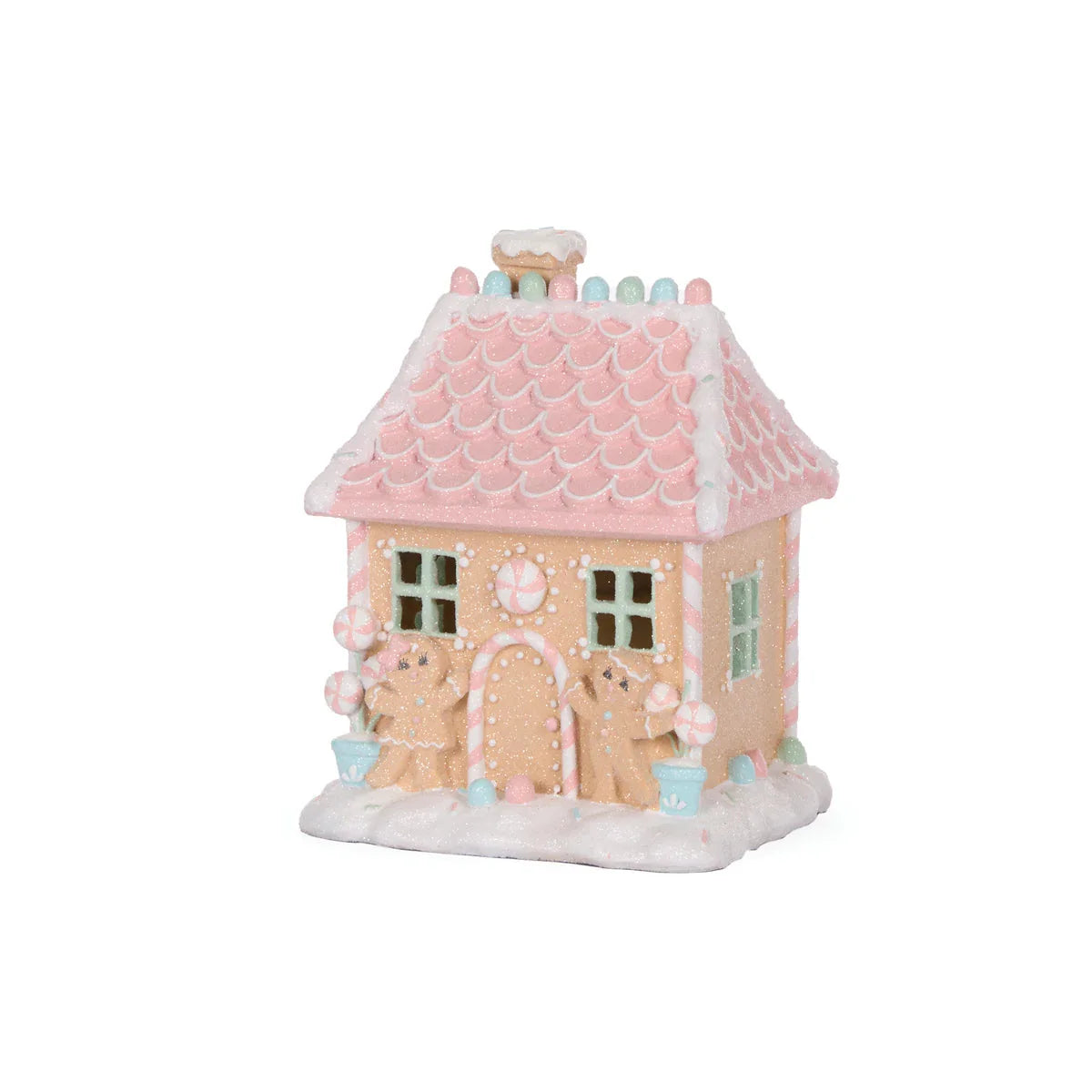 Pastel pink gingerbread house with candy decorations, perfect for festive home décor and holiday displays