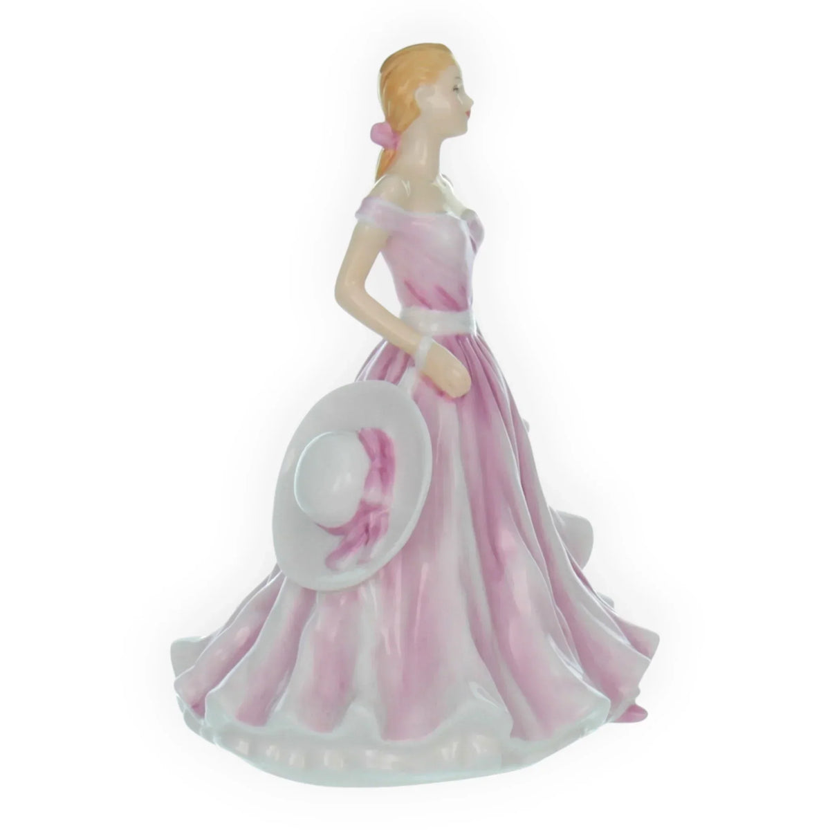 Elegant porcelain figurine of woman in pink gown holding hat, vintage home décor accent piece