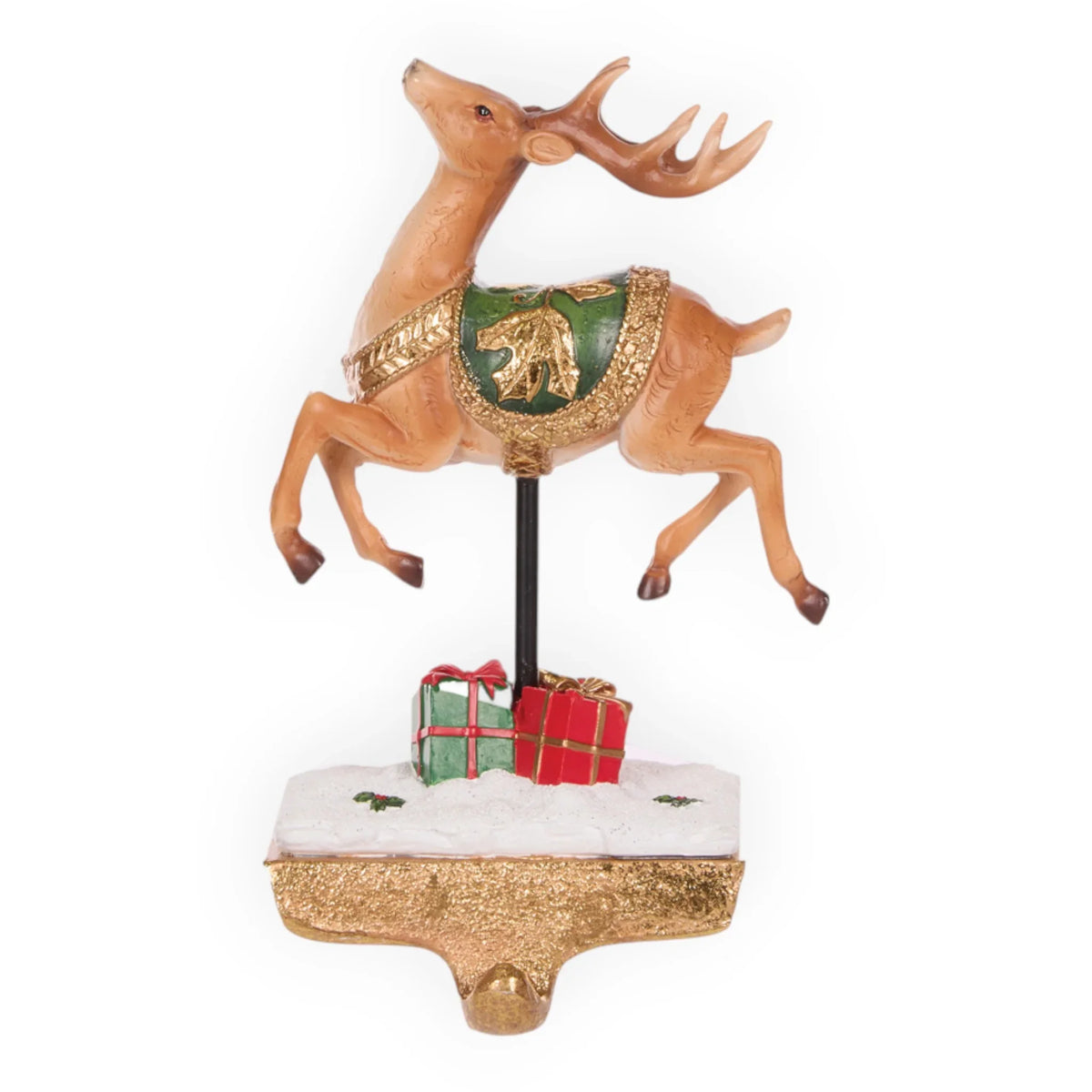 Leaping reindeer figurine with green and gold saddle, festive gifts on snowy base, holiday home décor
