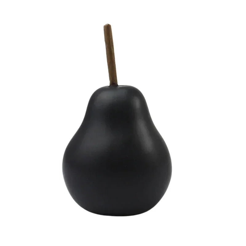 Black matte pear decor with wooden stem, modern home accessory for elegant interior styling