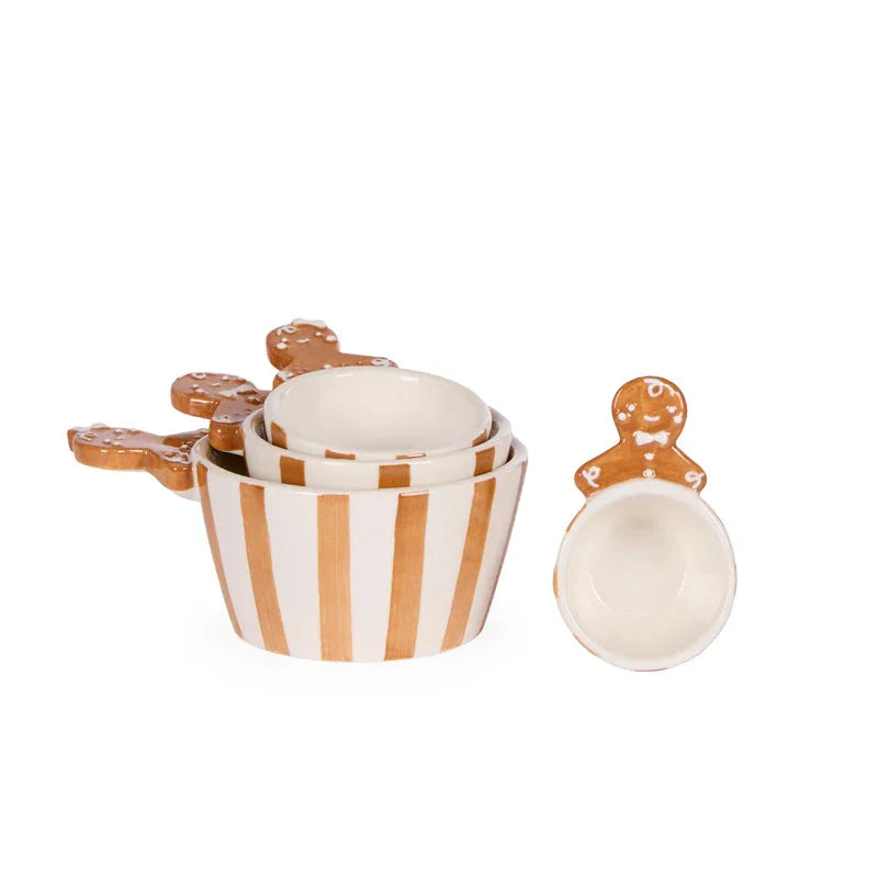 Ceramic gingerbread man measuring cups with striped design, festive kitchenware for baking