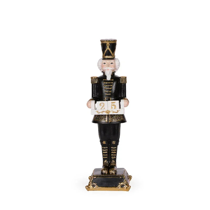 Black and gold nutcracker figurine holding '25' sign, elegant holiday home décor