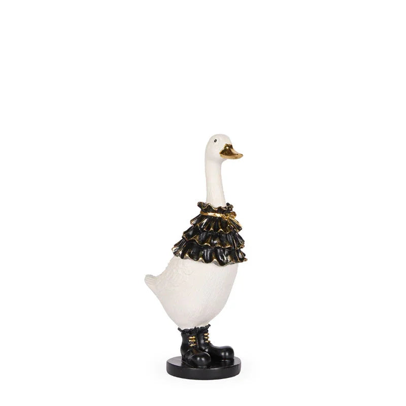 White ceramic goose figurine with black ruffled collar and boots, vintage home decor accent