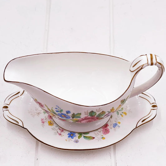 Vintage floral gravy boat with matching saucer, gold trim, elegant home decor
