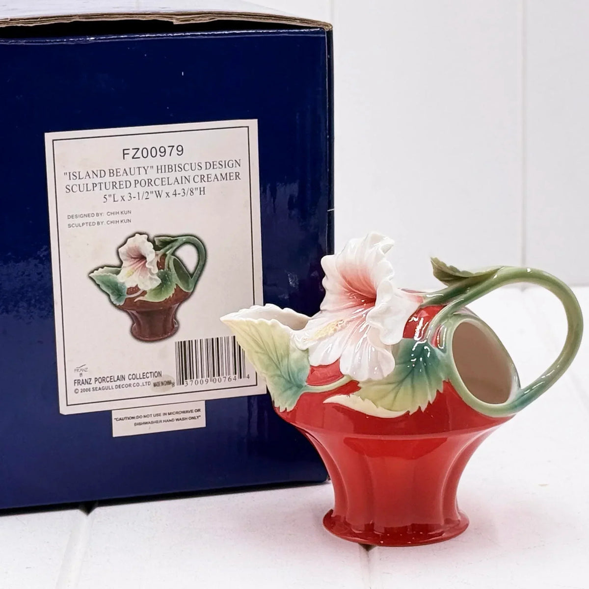 Red sculpted porcelain creamer with white hibiscus flower, vintage home decor accent piece
