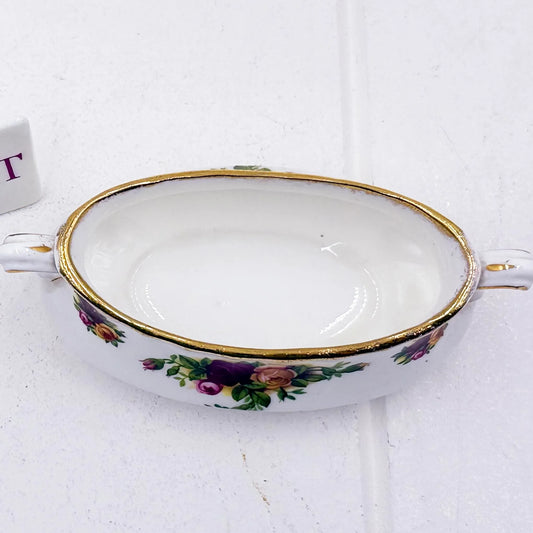 Vintage porcelain dish with floral roses, gold trim, and handles for elegant home décor
