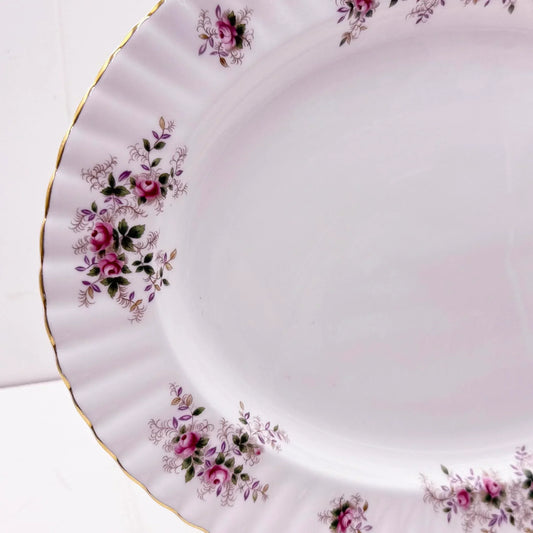 Elegant porcelain plate with pink rose floral design and gold trim, vintage home decor