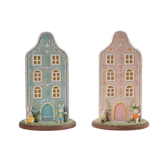 Charming pastel Easter bunny houses with glitter, flowers, and cute bunnies for home décor