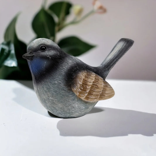 Grey bird figurine with blue chest, brown wings, home décor accent piece