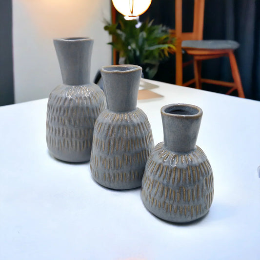 Set of three grey textured ceramic vases with gold accents, modern home dƩcor for living room or dining table