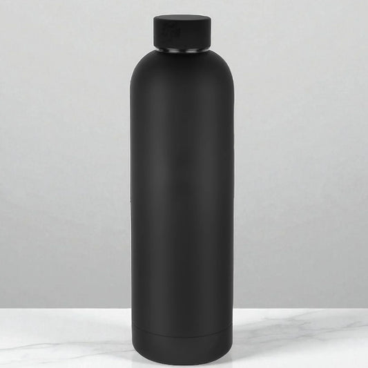 Matte black insulated water bottle on marble surface, modern home accessory