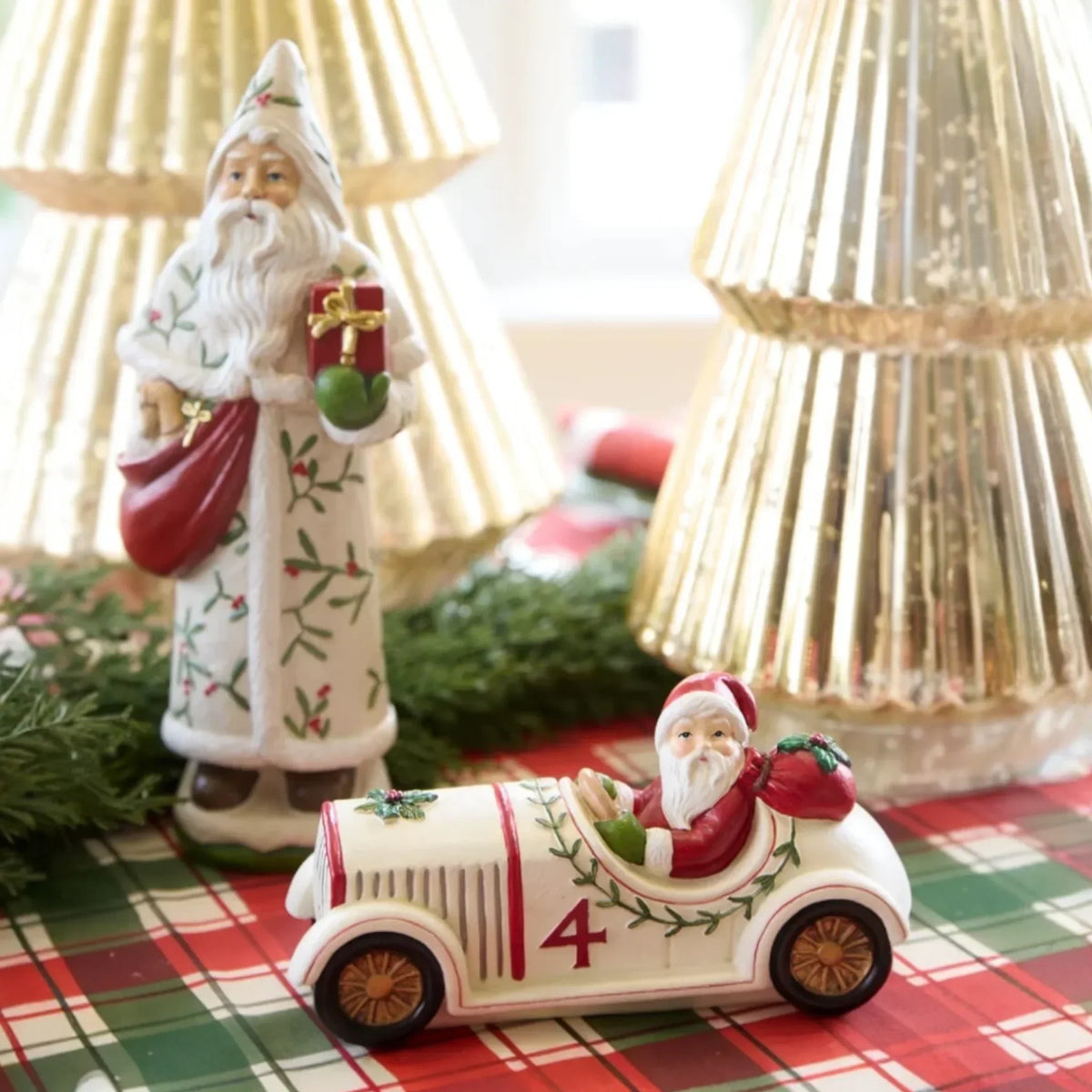 Santa figurine in vintage car with holiday decor, perfect for Christmas home styling and festive table settings