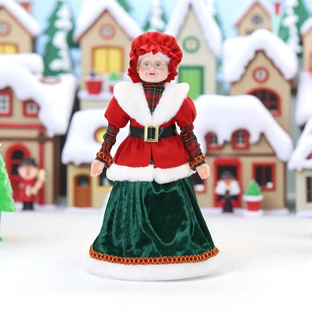 Festive Mrs. Claus figurine in red and green velvet, perfect for Christmas home décor and holiday displays.