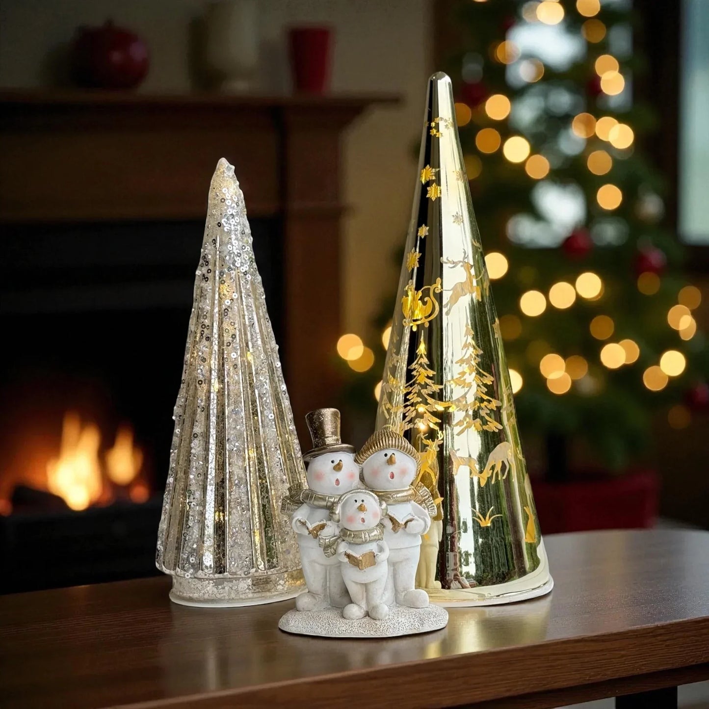 Festive snowman family figurine with glittery and gold Christmas trees, perfect for holiday home décor