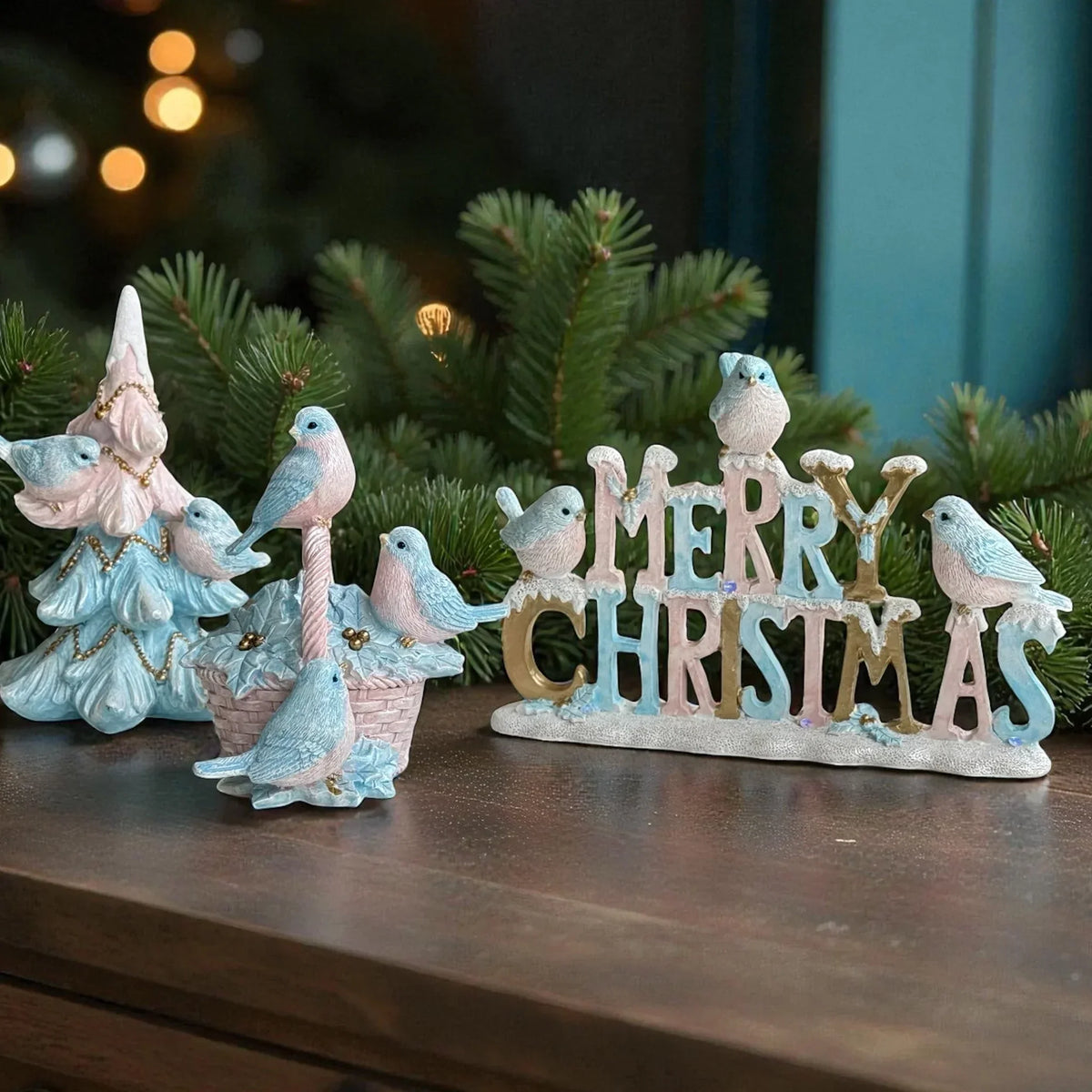 Pastel Christmas decor with birds, tree, and 'Merry Christmas' sign for festive home styling