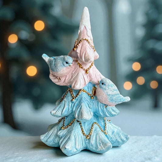 Pastel blue and pink Christmas tree figurine with two birds and gold bead garlands, festive holiday decor