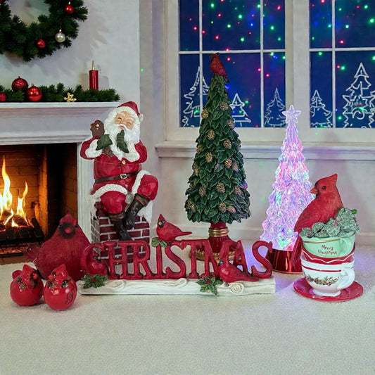 Santa figurine, cardinal birds, Christmas trees & 'CHRISTMAS' sign for festive home décor