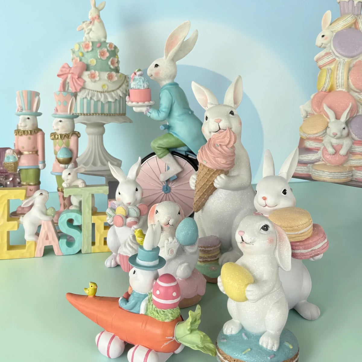 Charming Easter bunny figurines with pastel cakes, macarons, and eggs for spring home décor