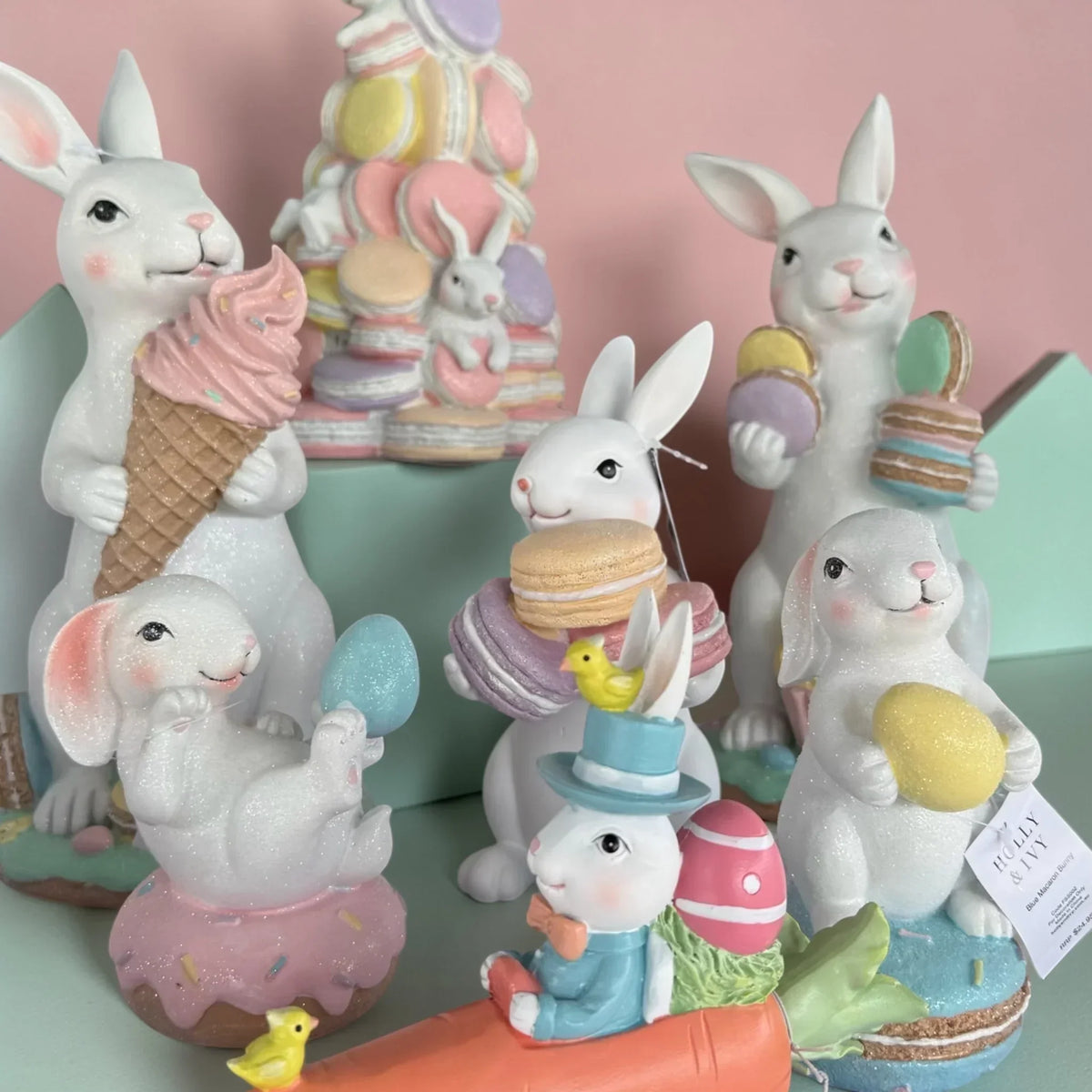 Charming Easter bunny figurines with macarons, ice cream, and eggs for spring home décor