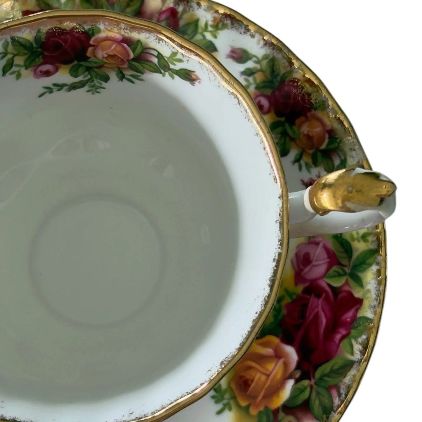 Vintage porcelain teacup with rose floral pattern and gold trim, elegant home décor accent