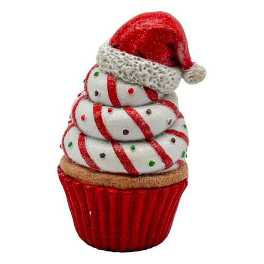 Festive cupcake with Santa hat, red and white swirls, holiday decoration