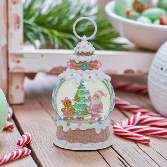 Festive snow globe with Santa, gingerbread, and Christmas tree, surrounded by candy canes