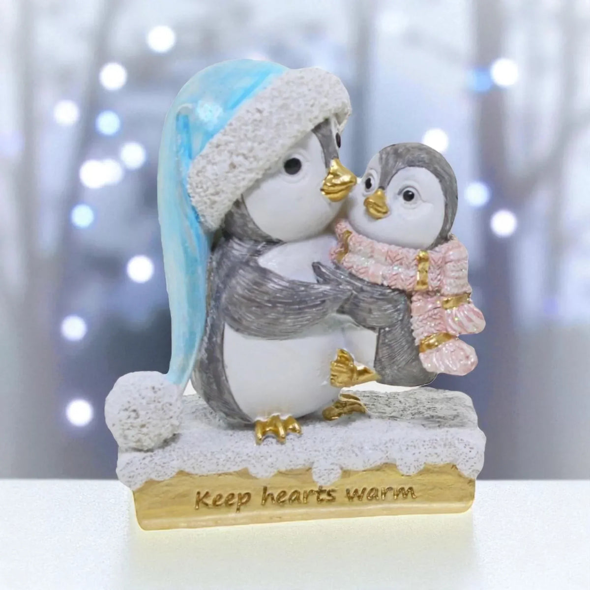 Adorable penguin figurine with baby, winter hat & scarf, 'Keep hearts warm' base — perfect home décor
