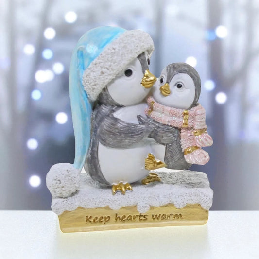 Adorable penguin figurine with baby, winter hat & scarf, 'Keep hearts warm' base — perfect home décor