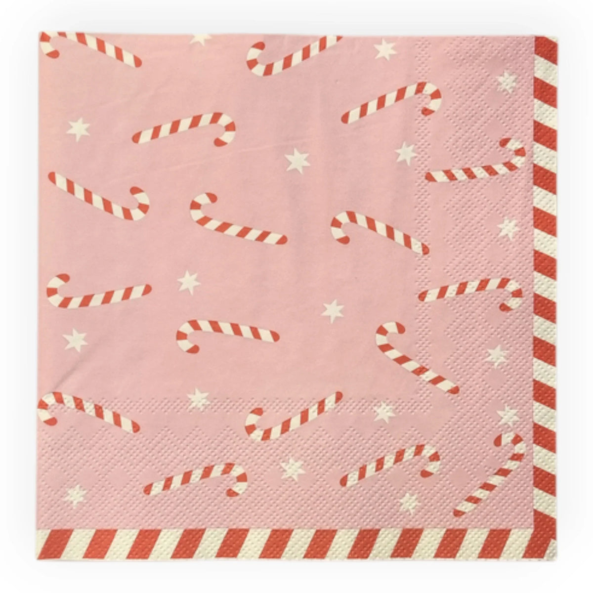 Pink holiday napkin with candy cane and star pattern, festive tableware for Christmas celebrations