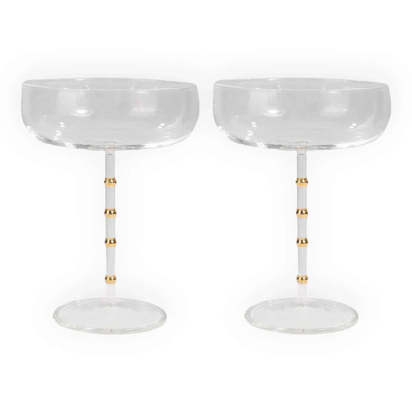 Elegant champagne coupes with gold-accented stems, perfect for luxury home décor and vintage-inspired entertaining.