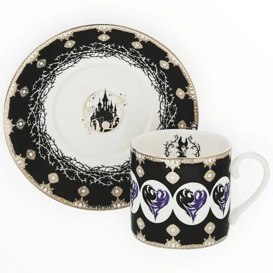 Maleficent-themed black and gold mug and plate set with castle and thorn designs, elegant home décor