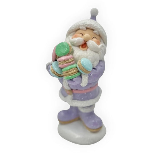 Pastel Santa figurine holding glitter macarons, festive home décor accent
