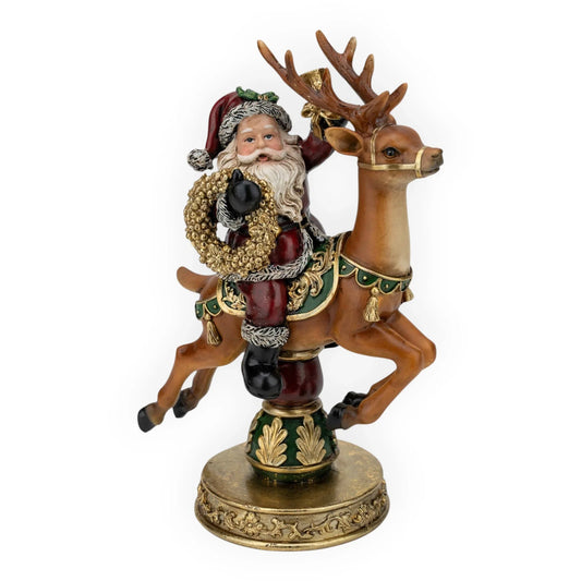 Santa Claus riding reindeer figurine with wreath, holiday home decor ornament
