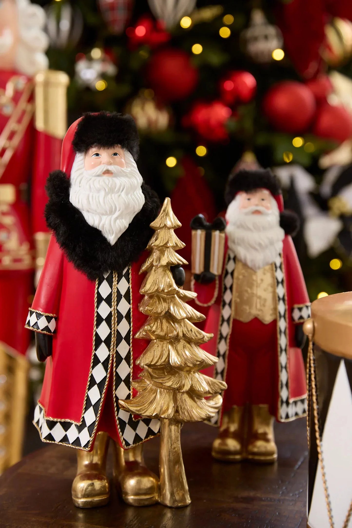 Harlequin Santa With Gift - 30cm 