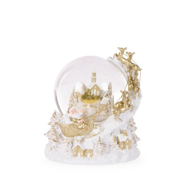 Santa in golden sleigh with reindeer, snow globe Christmas decoration, festive village scene